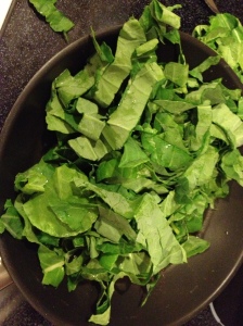 Add greens to pan after sauteeing garlic and peppers.photo credit: Words Etc.